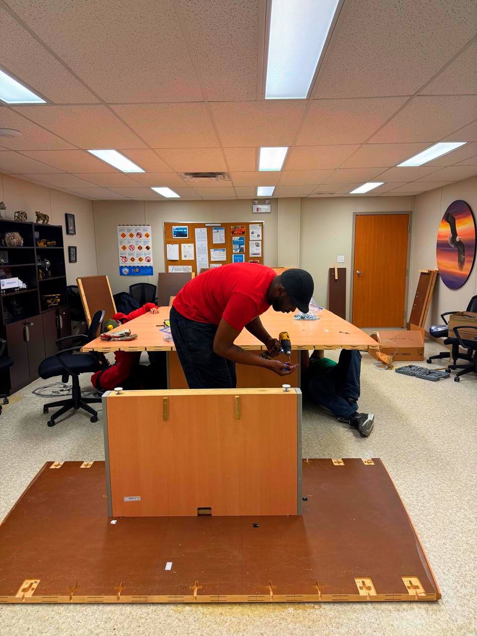 Horizon Moving crew assembling office furniture during commercial relocation Fort McMurray